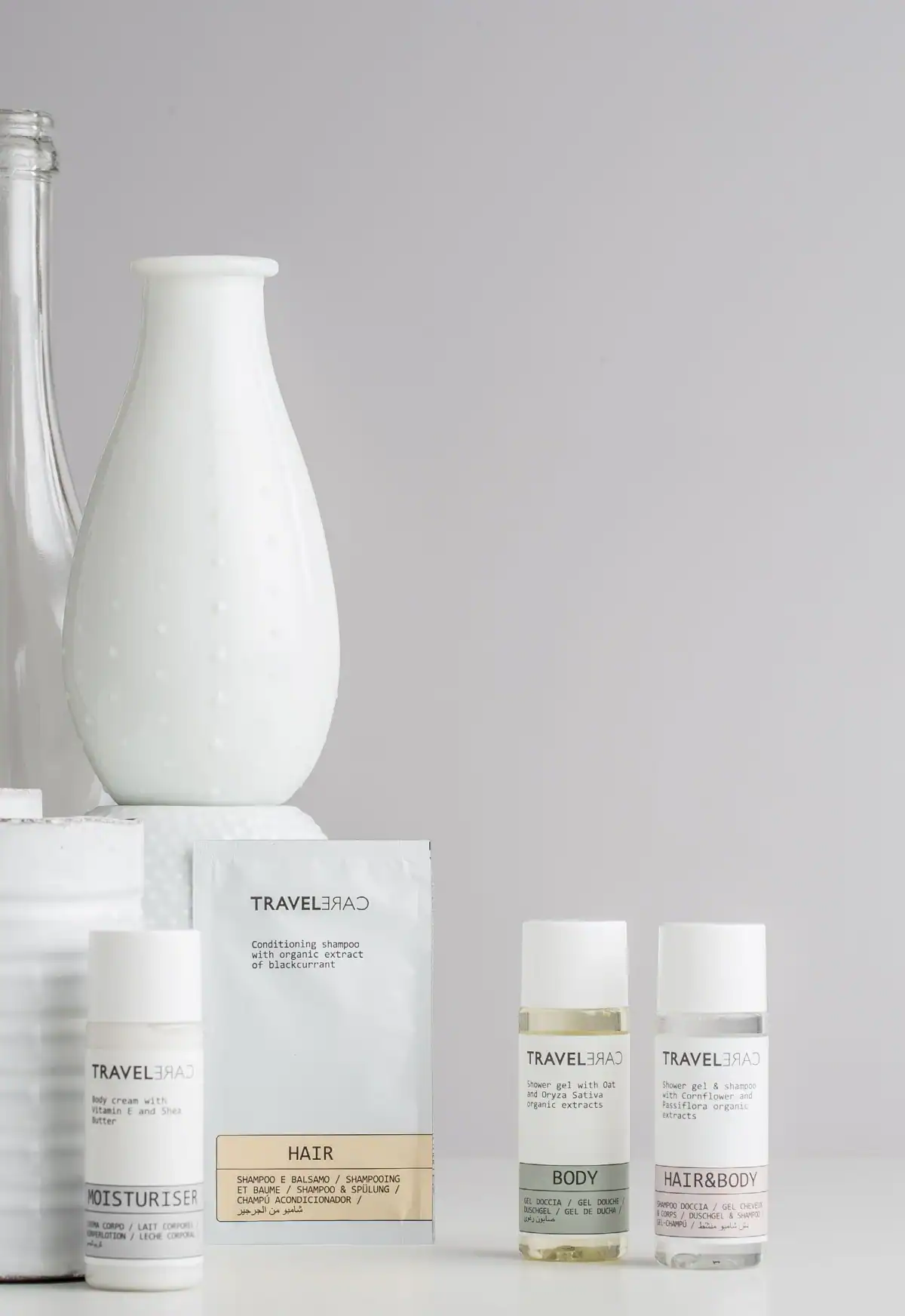 White setting with cosmetics and details from the Travel Care collection
